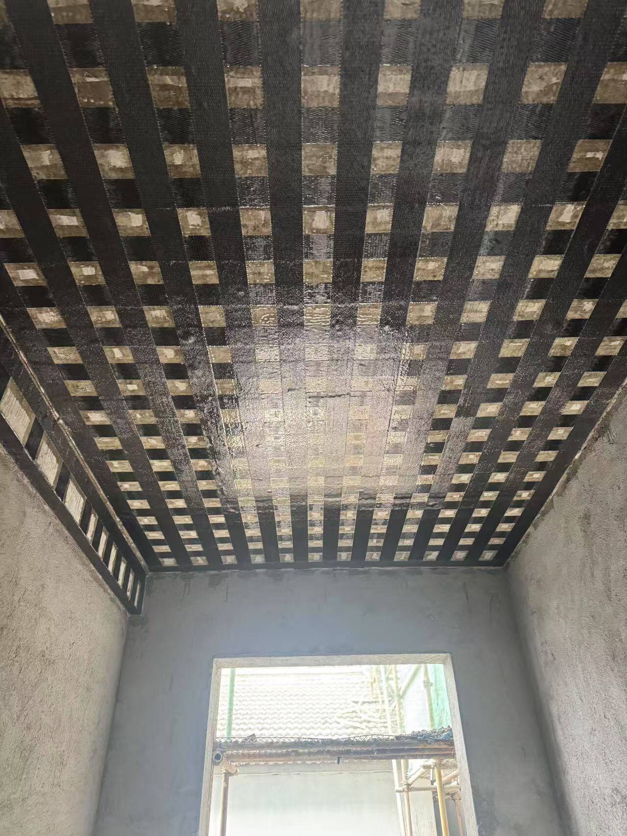 Carbon Fiber Sheet Strengthening of Concrete Structures