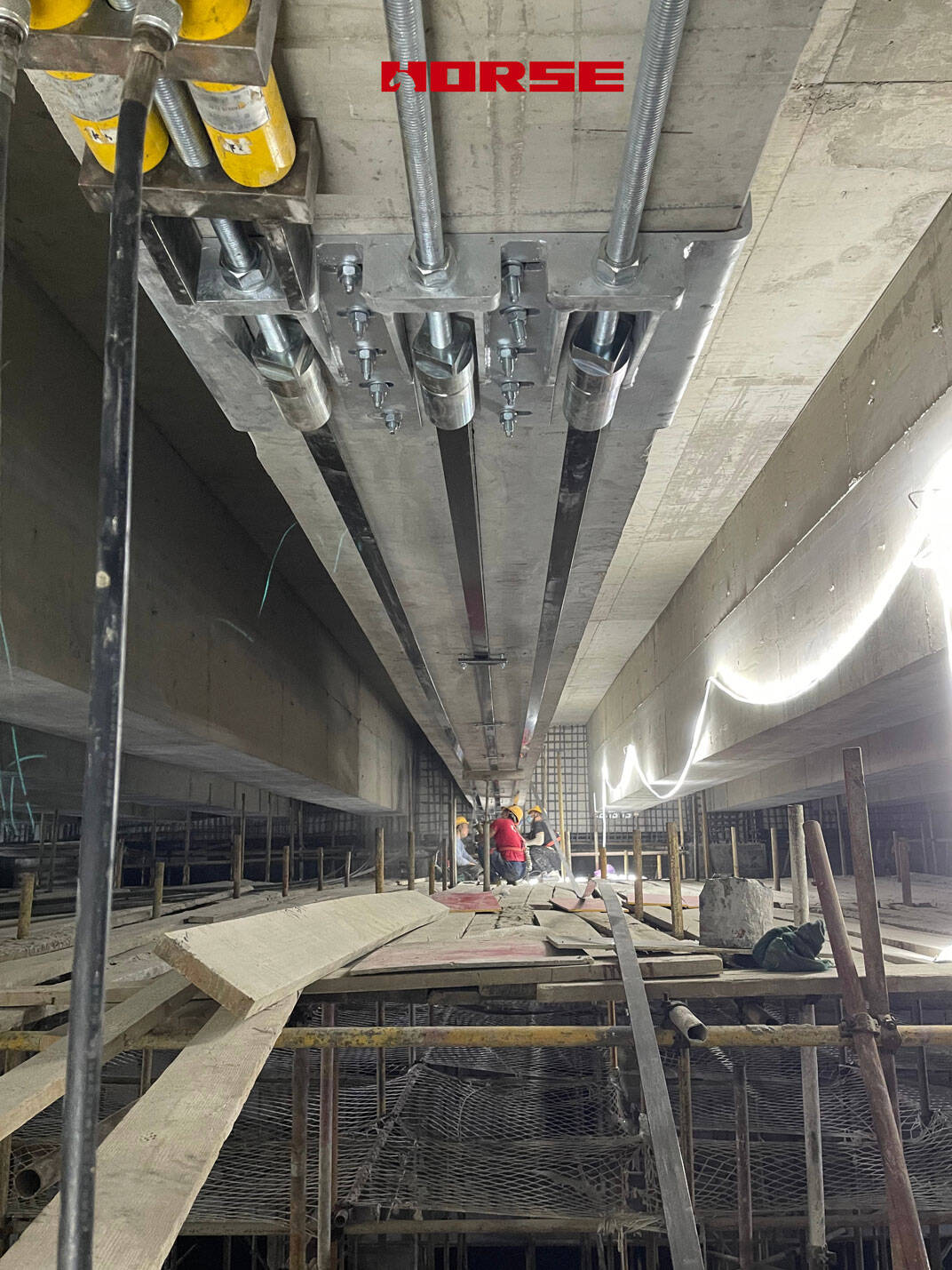 Post-Tensioning Carbon Fiber Reinforced Plastic (CFRP) Plates